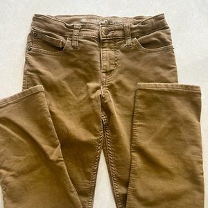 Tan jeans. Slim cut.  Super stretch material with adjustable waist band.